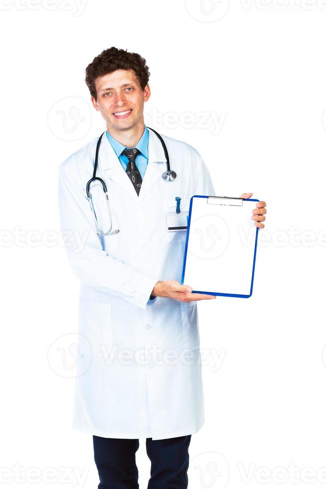 Smiling male doctor showing clipboard with copy space for text photo