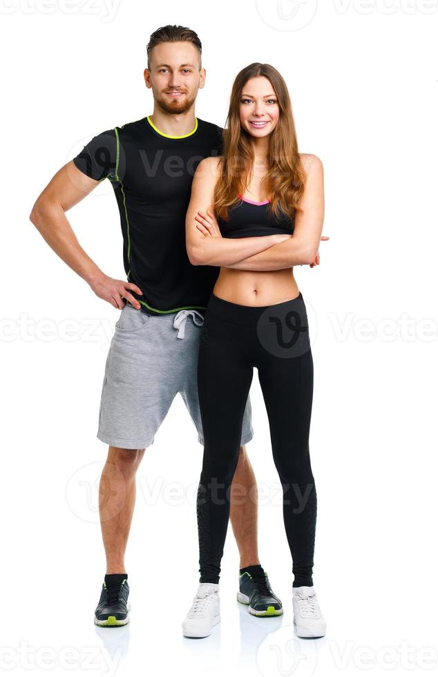 Athletic man and woman after fitness exercise on the white photo