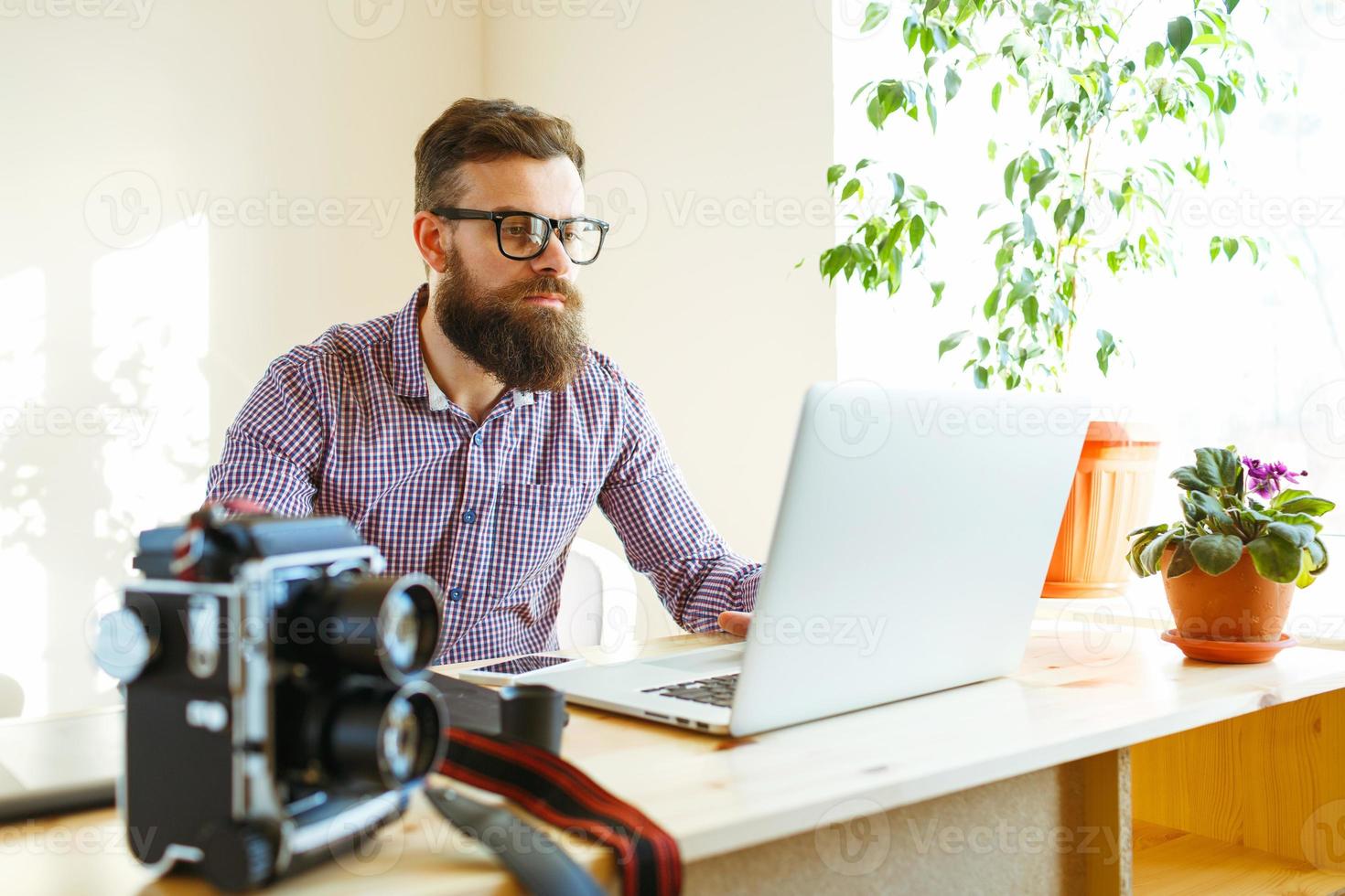 Beard young man working from home photo