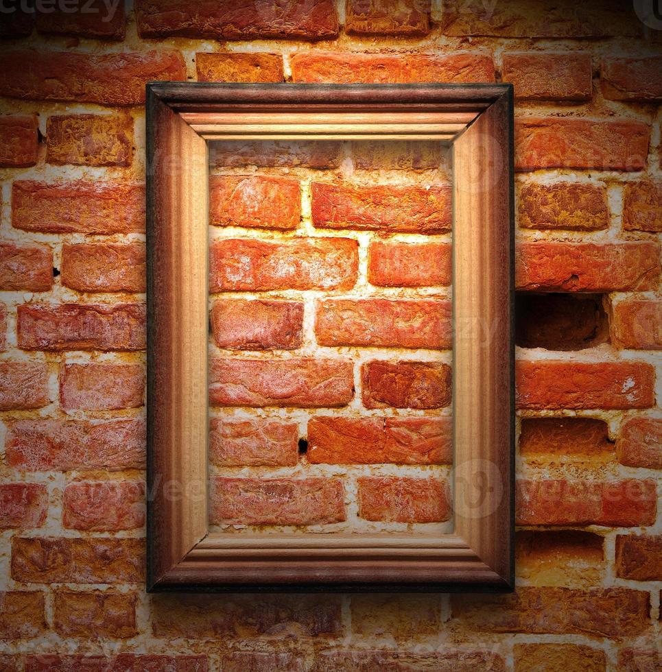 The wood frame on brown brick wall photo