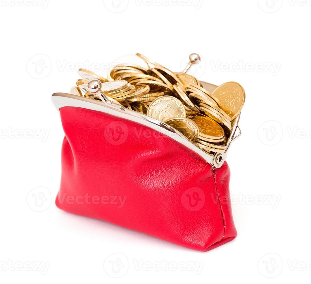 Red purse full of gold coins on a white photo