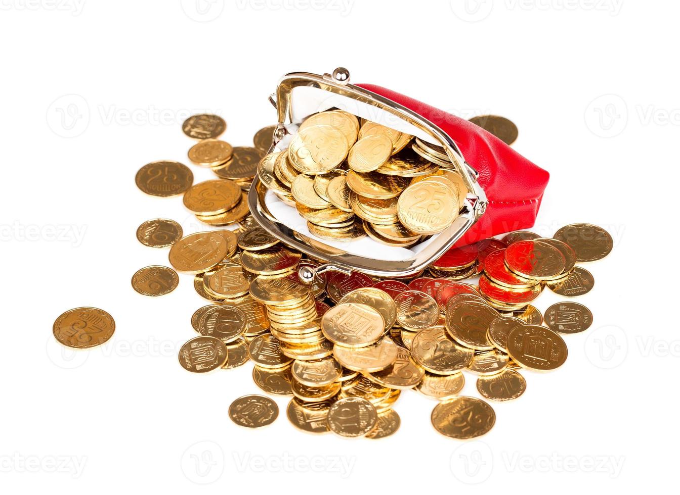 Red purse full of gold coins on a white photo