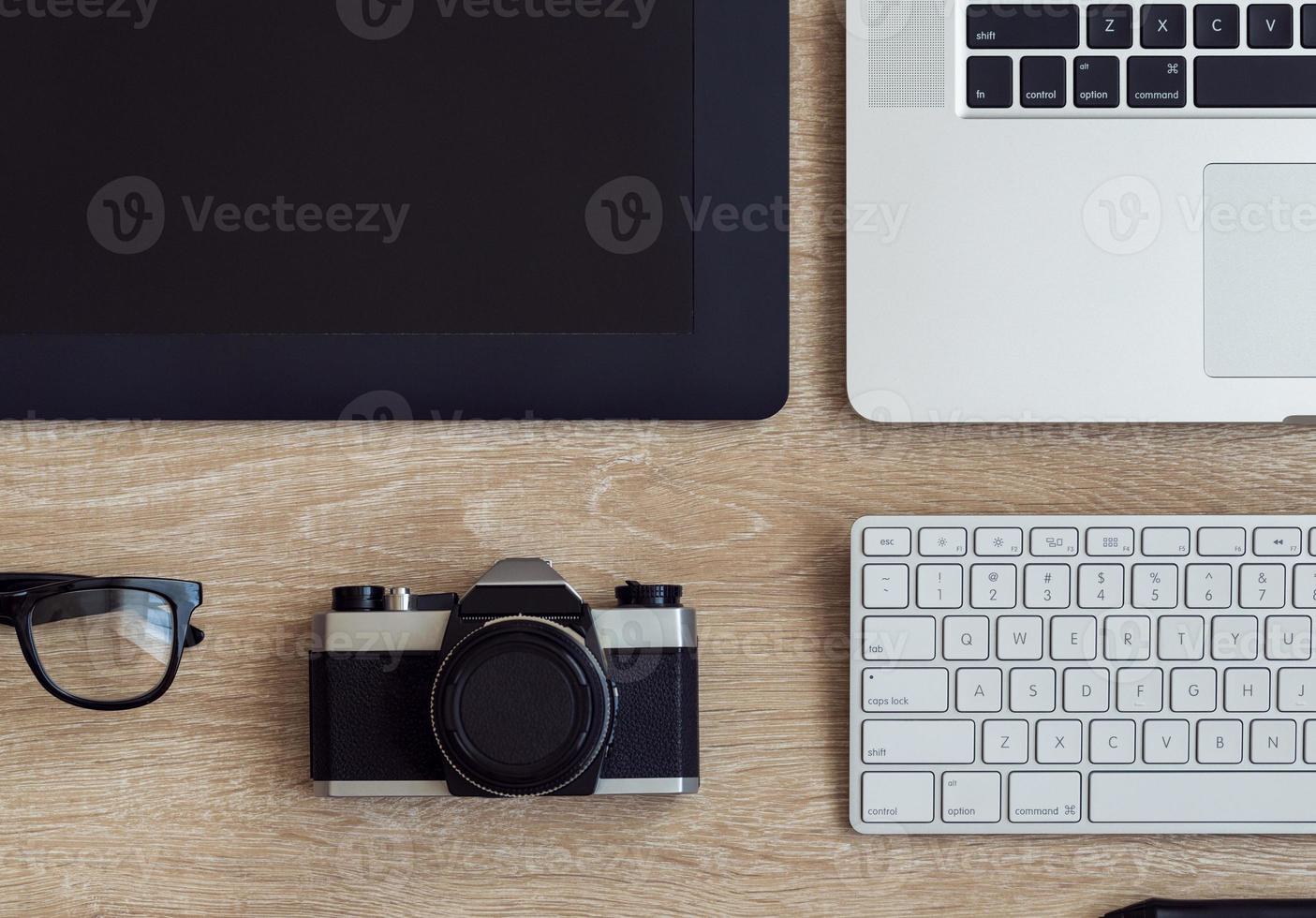 Business workplace with laptop and gadgets on wooden background photo