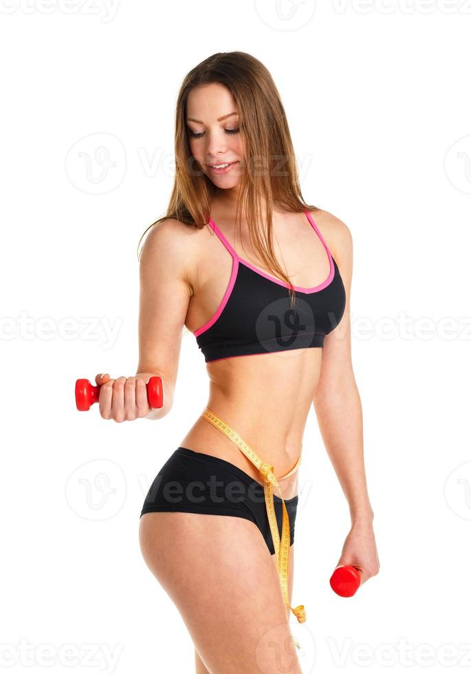 Happy athletic woman with dumbbells doing sport exercise, isolated on white photo
