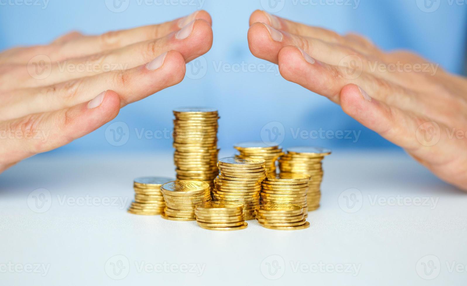 Protect new business start-up concept with hands and coin photo