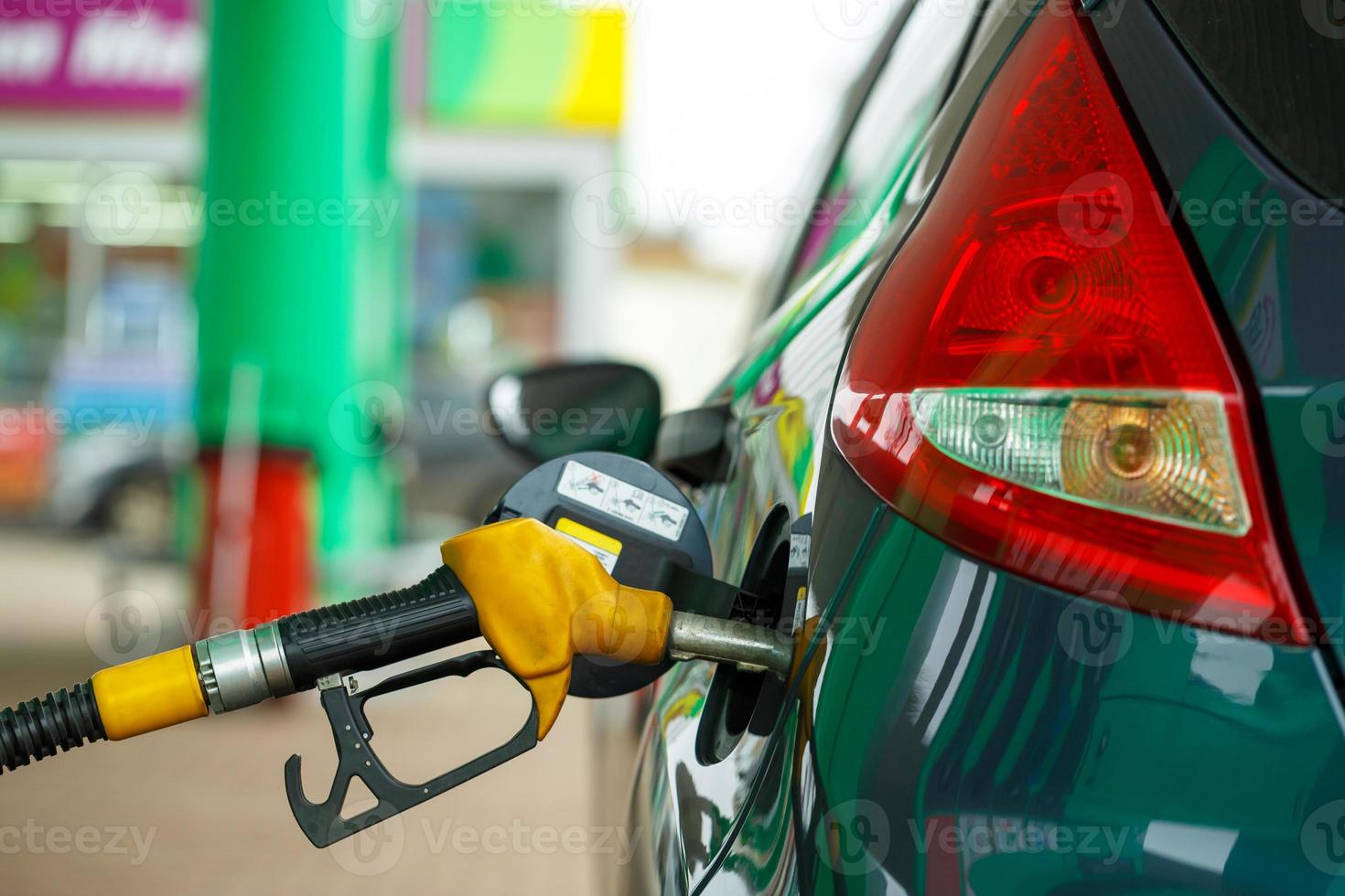 Car refueling on a petrol station photo