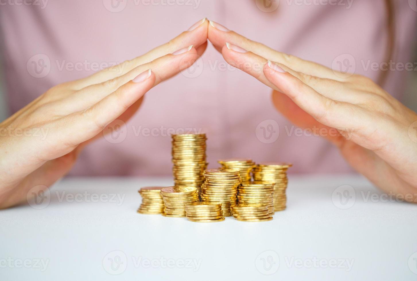 Protect new business start-up concept with hands and coin photo