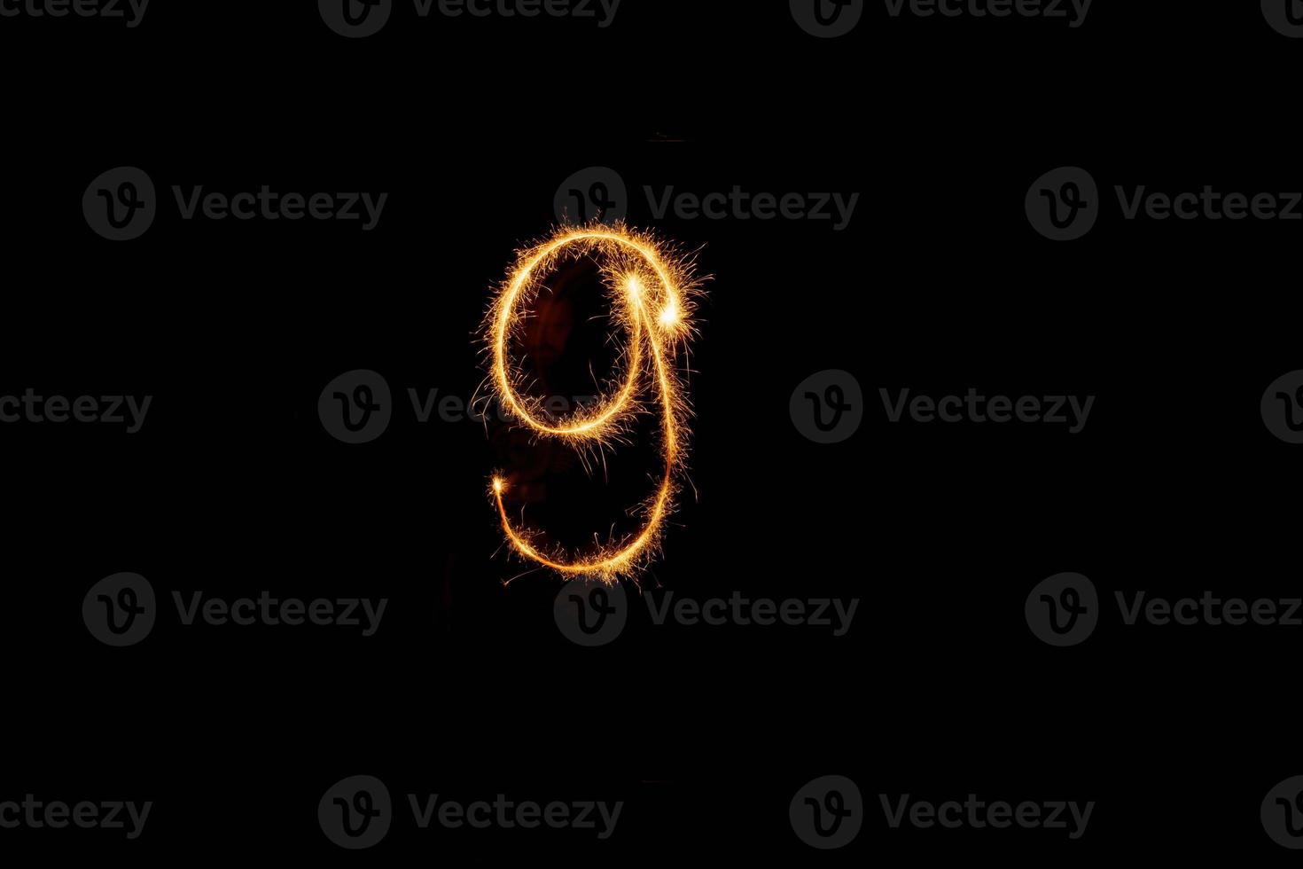 Number made with sparklers ready for your inscriptions on black background photo