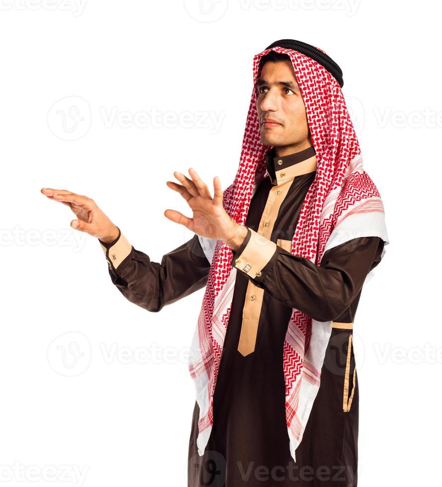 Arab man pressing virtual button on white photo