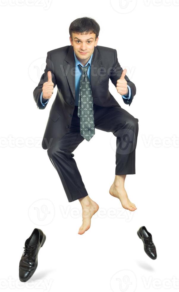 Jumping businessman on white background photo