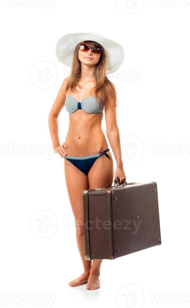 Full length portrait of a beautiful young woman posing in a bikini on white photo