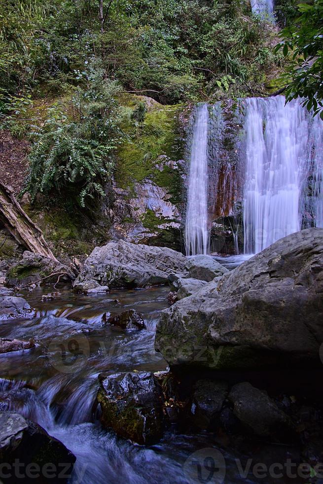 waterfall hiden in the forest photo
