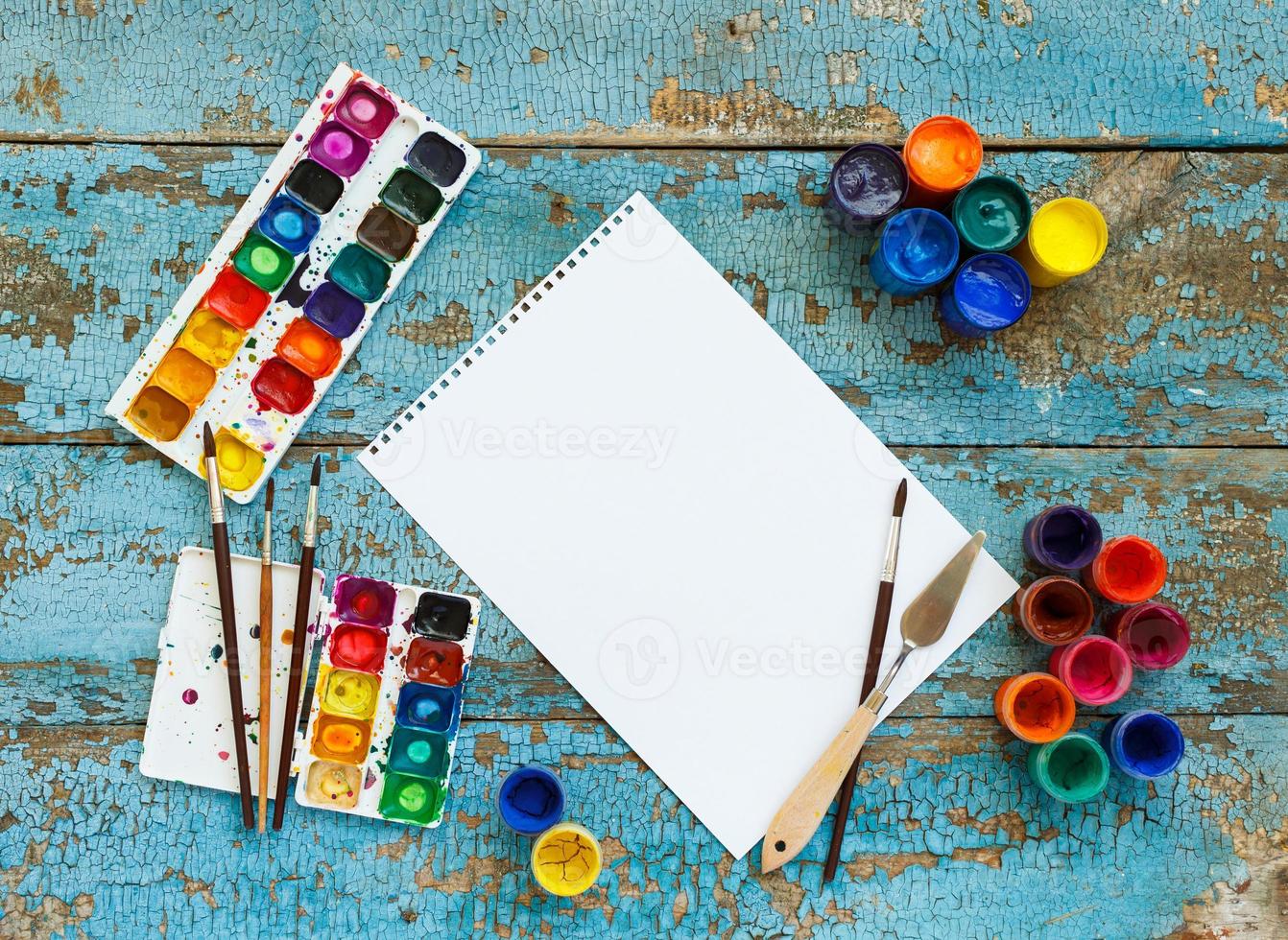 Art painting materials on wooden background photo