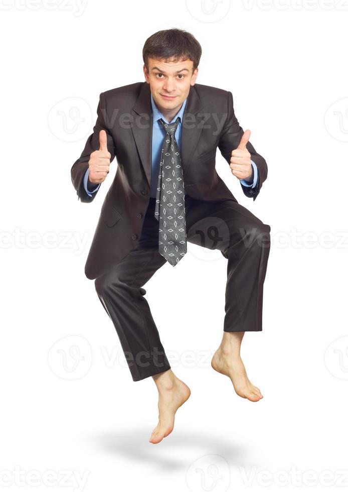 Jumping businessman on white background photo