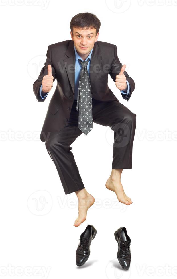 Jumping businessman on white background photo