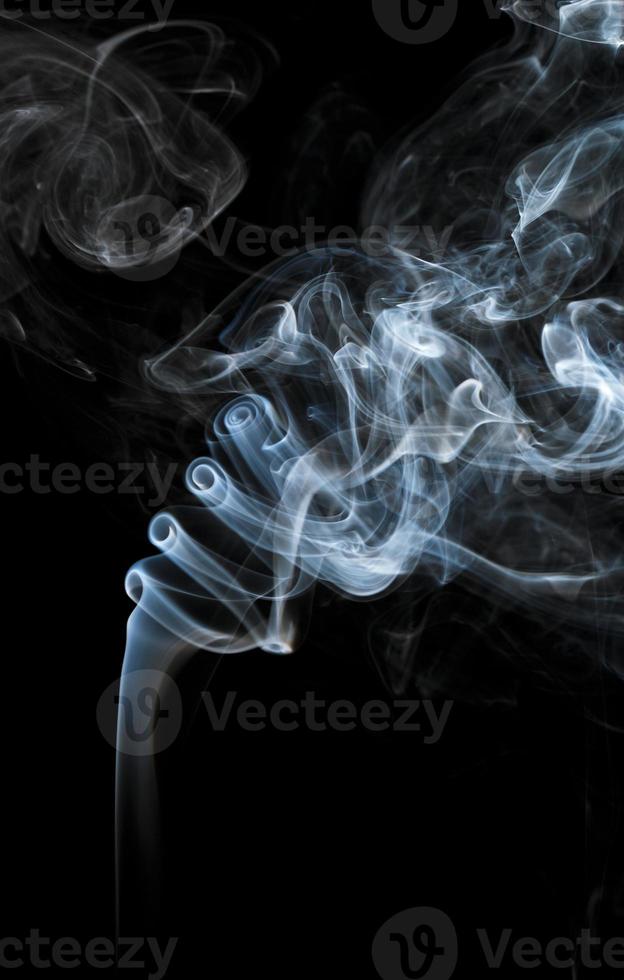 Abstract light smoke on a black background photo