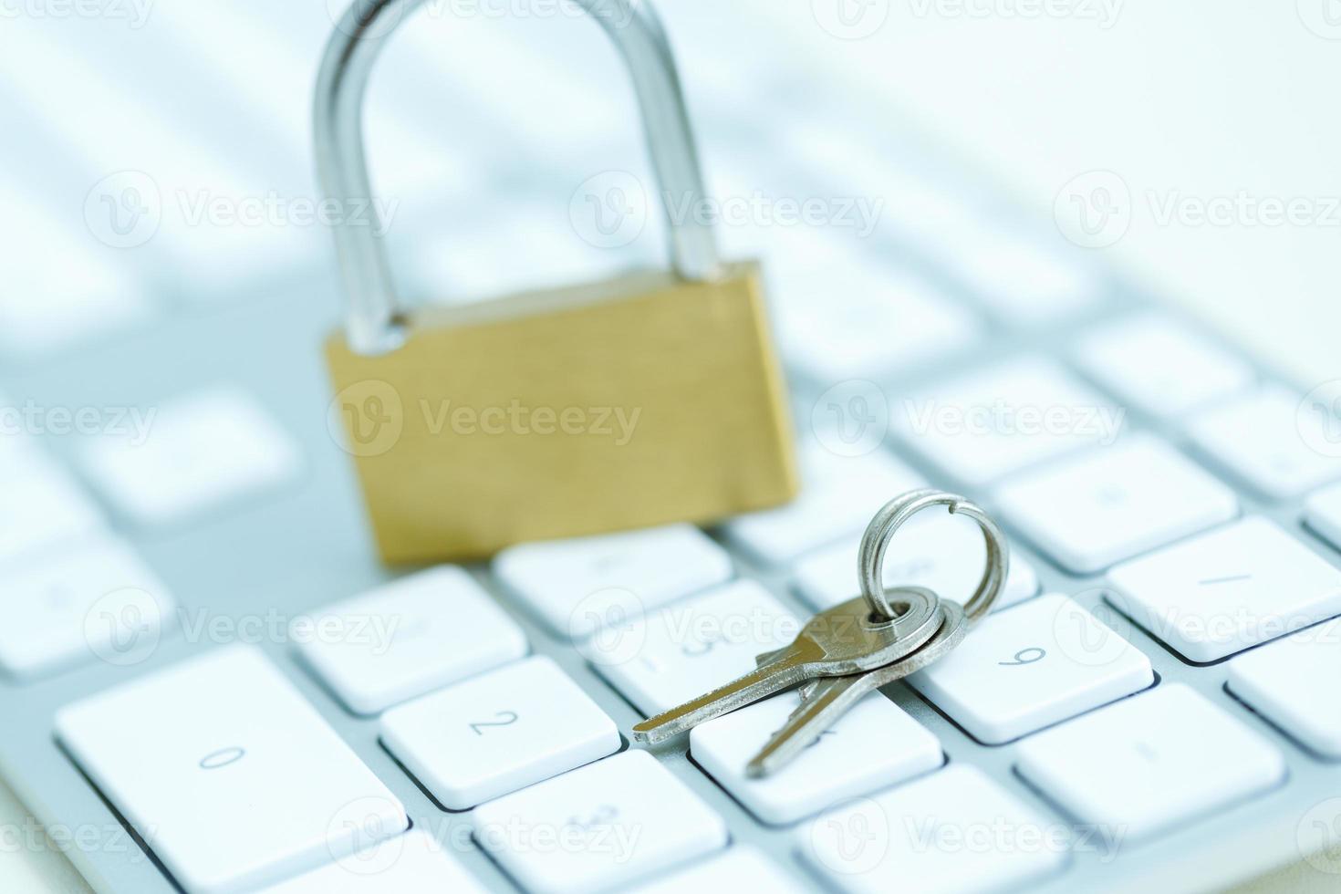 Security lock on white computer keyboard photo