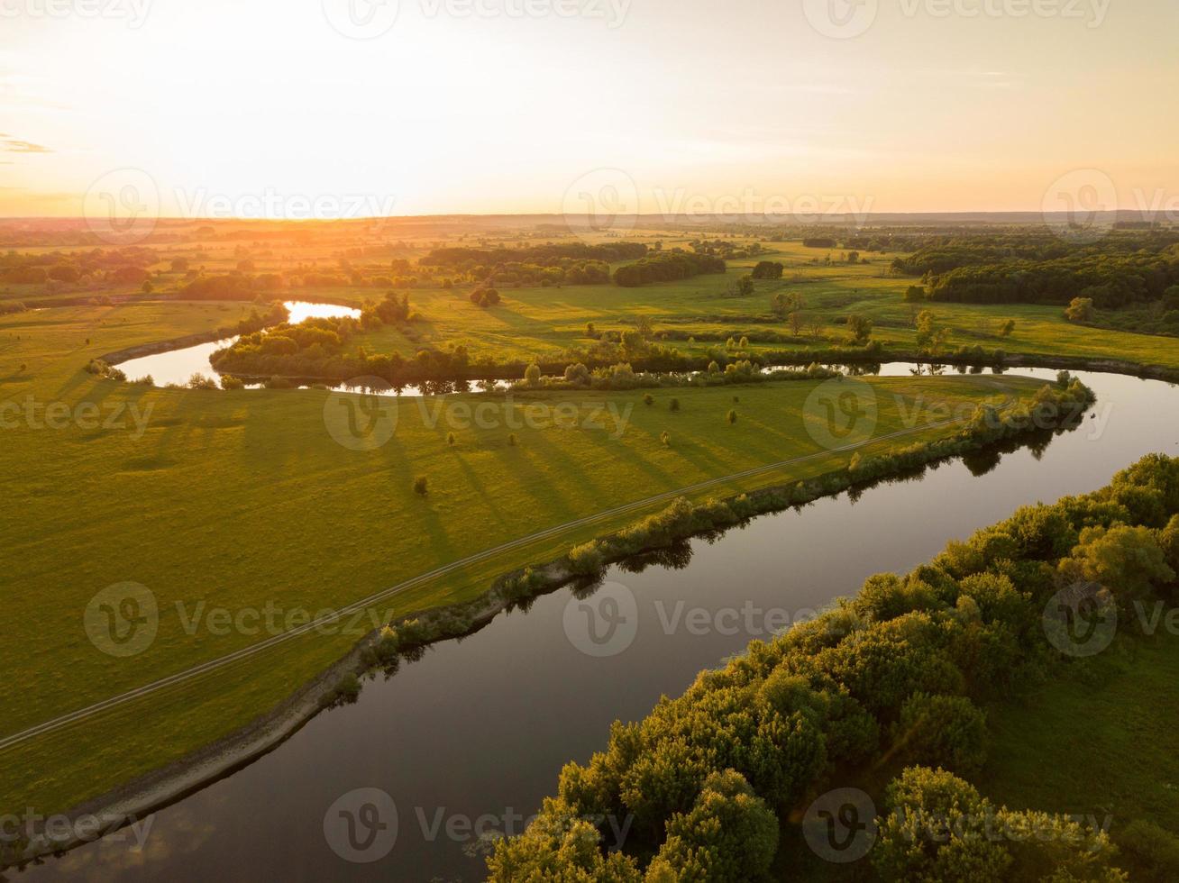 Top view of the Seim River, Ukraine, surrounded by trees and meadows on its banks, view from the top photo