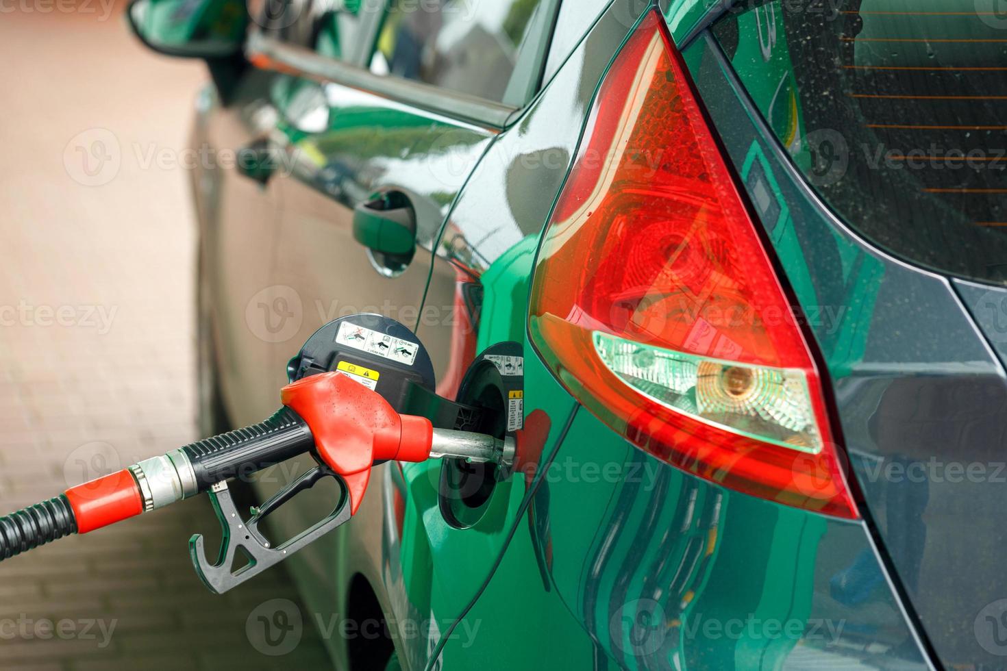 Car refueling on a petrol station photo