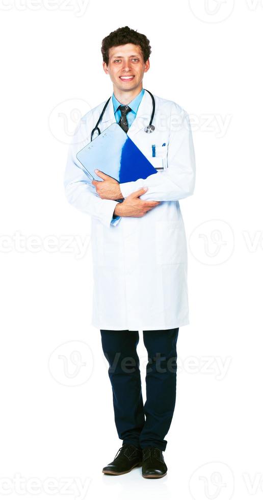 Full length portrait of a smiling male doctor holding a notepad on white photo