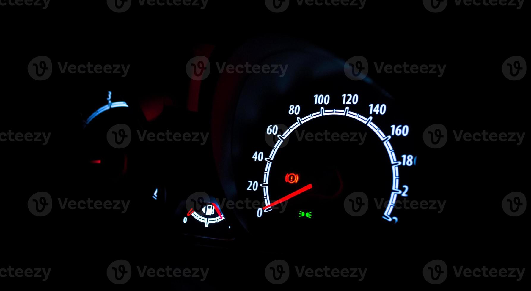 Speedometer illuminated at night photo