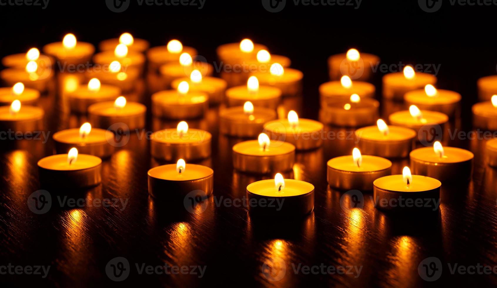 Many burning candles with shallow depth of field photo