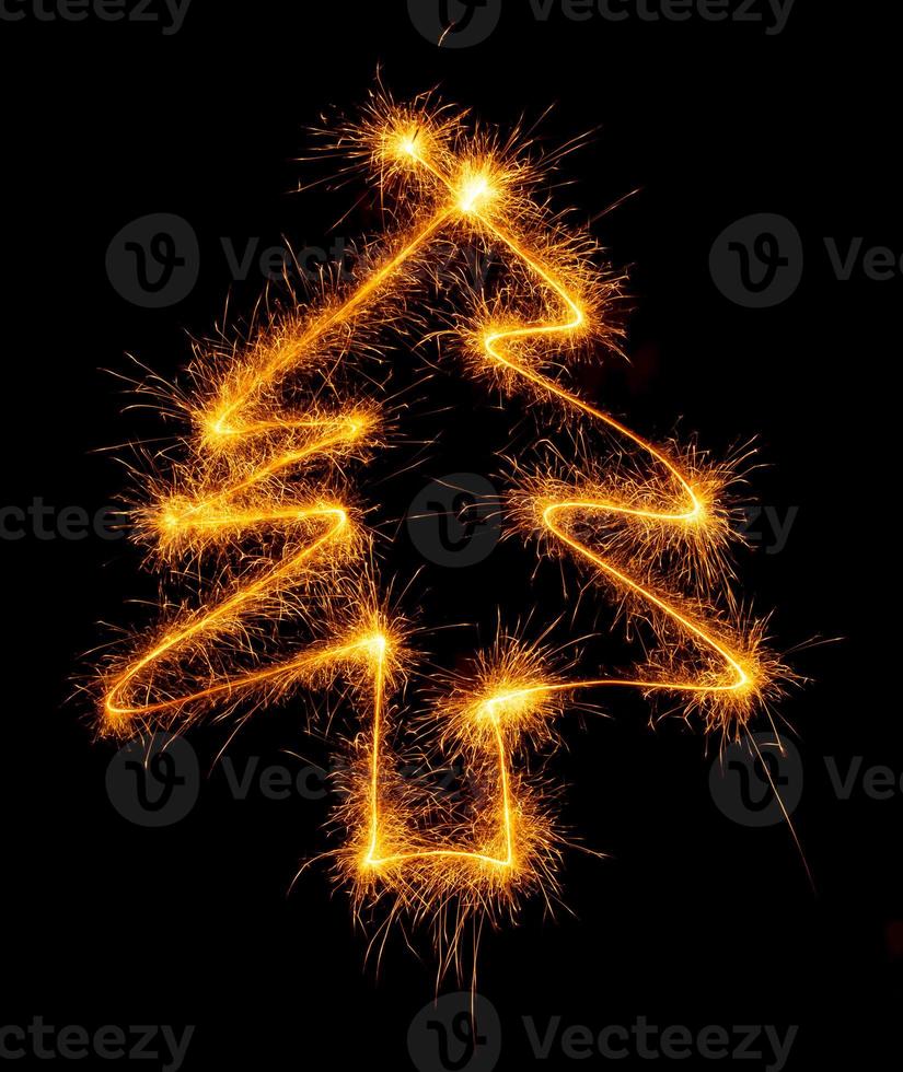 Tree made with sparklers ready for your inscriptions on black background photo