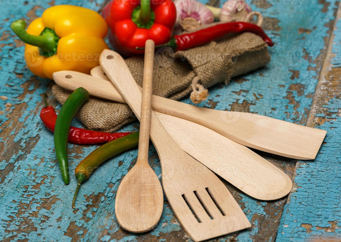 Wooden spoons with vegetables photo