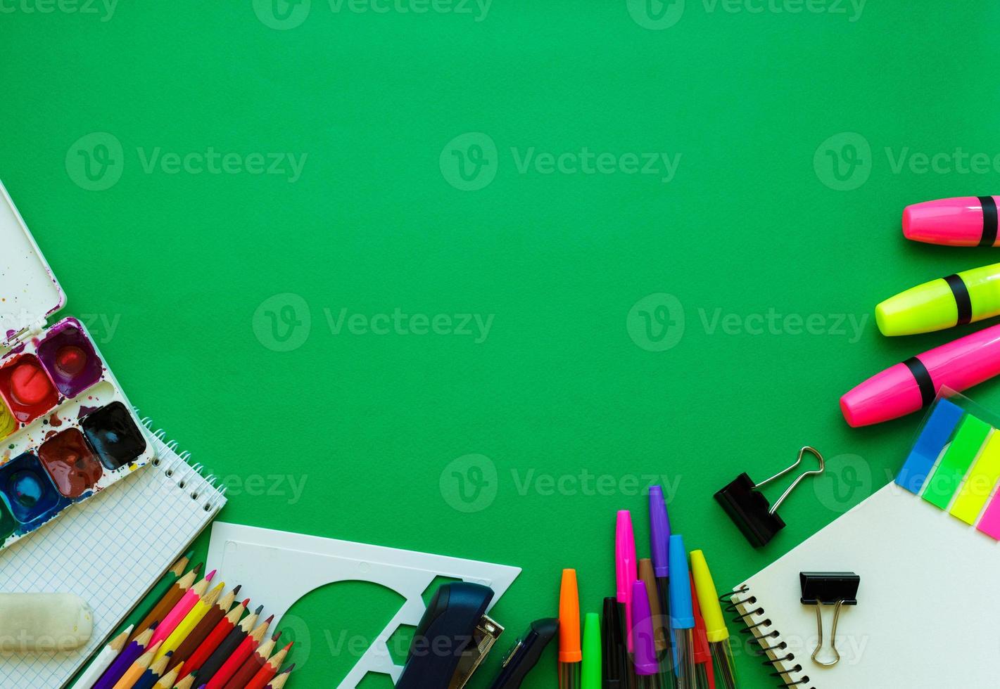 School supplies on blackboard background ready for your design photo