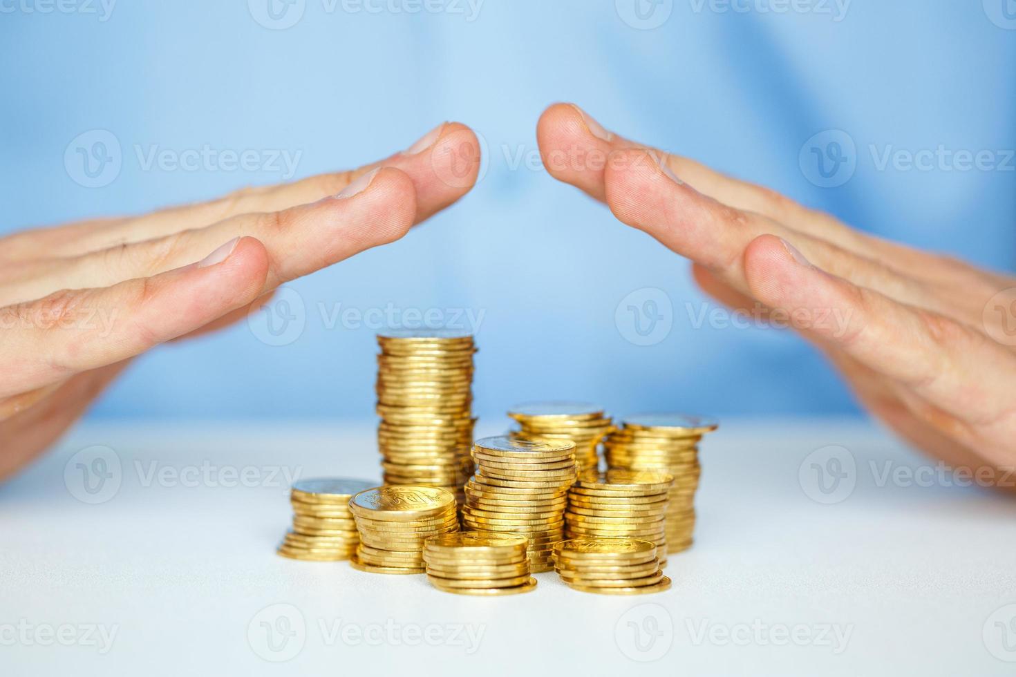 Protect new business start-up concept with hands and coin photo