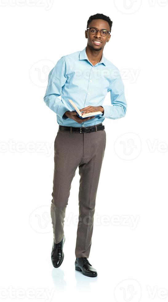 Happy african american college student with books in his hands photo