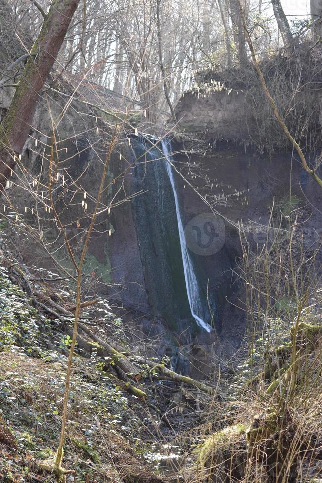 thin waterfall of the wolves gorge in the Eifel photo