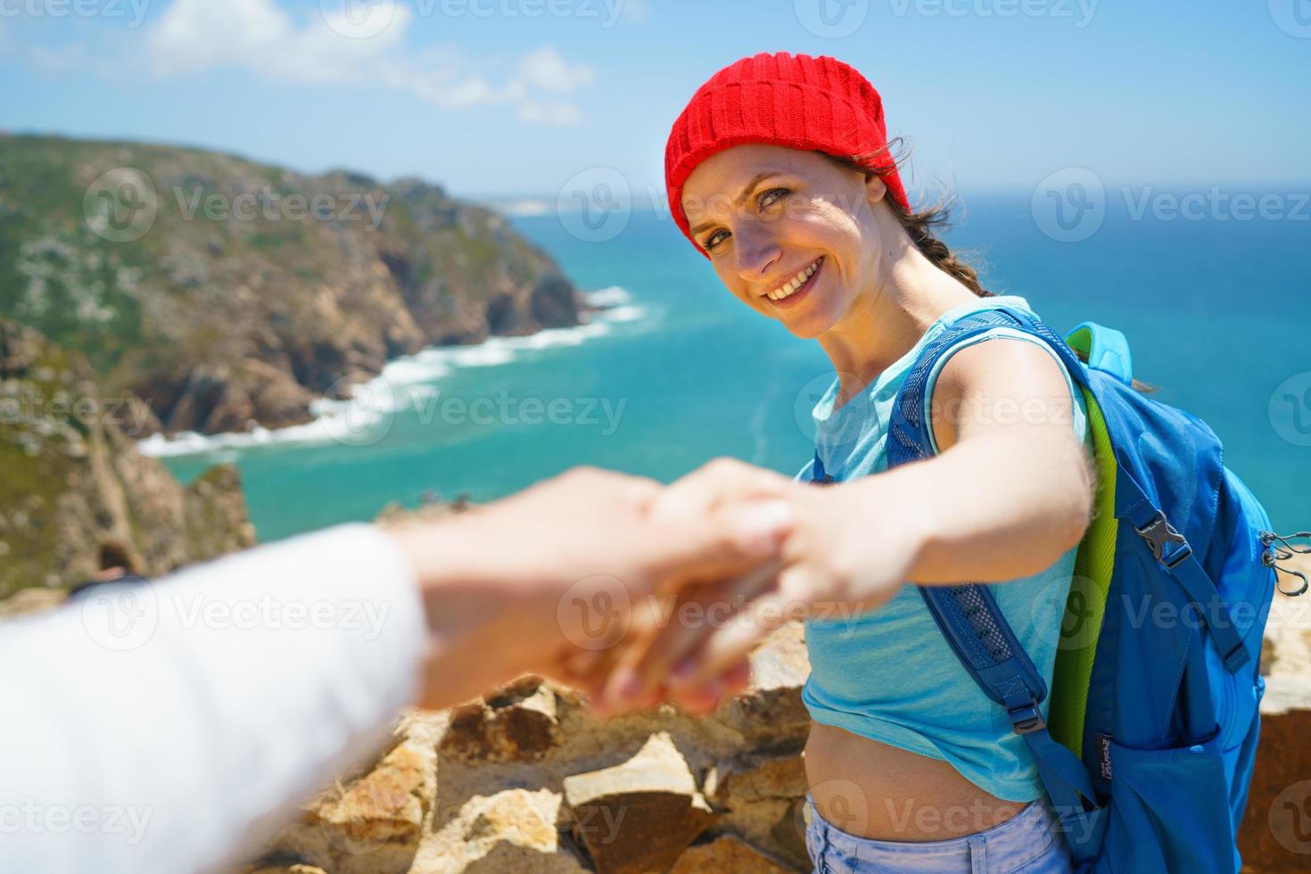 Woman by a beautiful coast photo