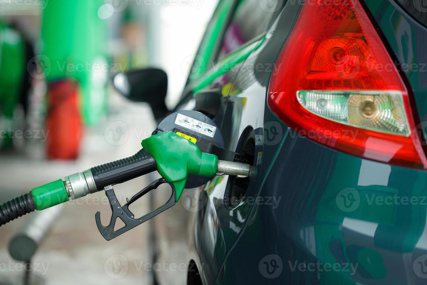 Car refueling on a petrol station in winter close up photo