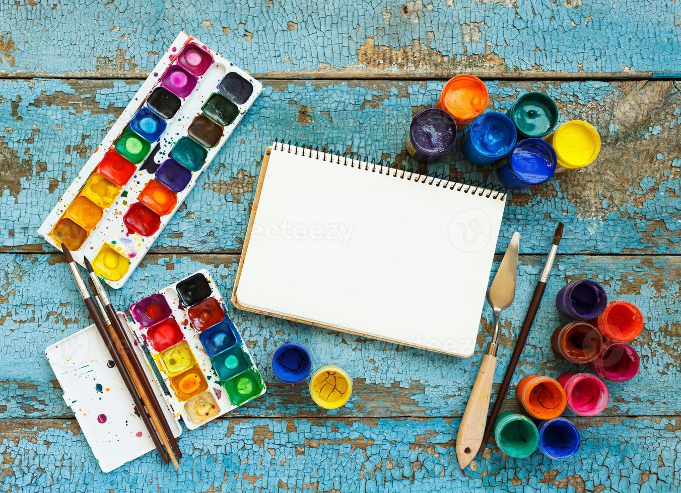 Art painting materials on wooden background photo