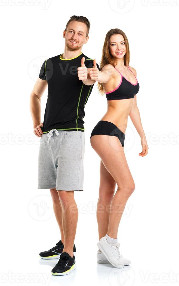 Athletic man and woman after fitness exercise with thumb up on the white photo