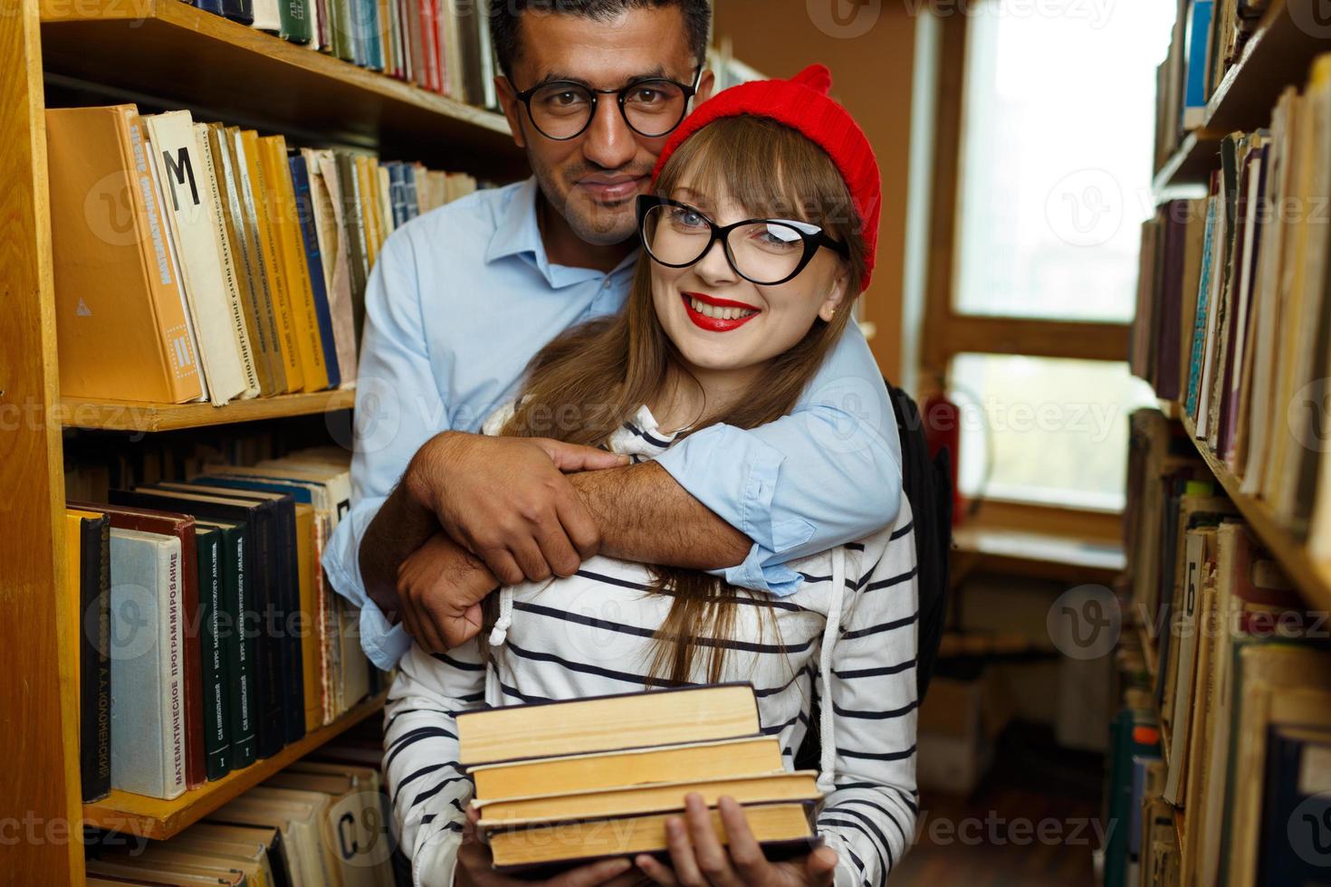 Young couple at the library photo