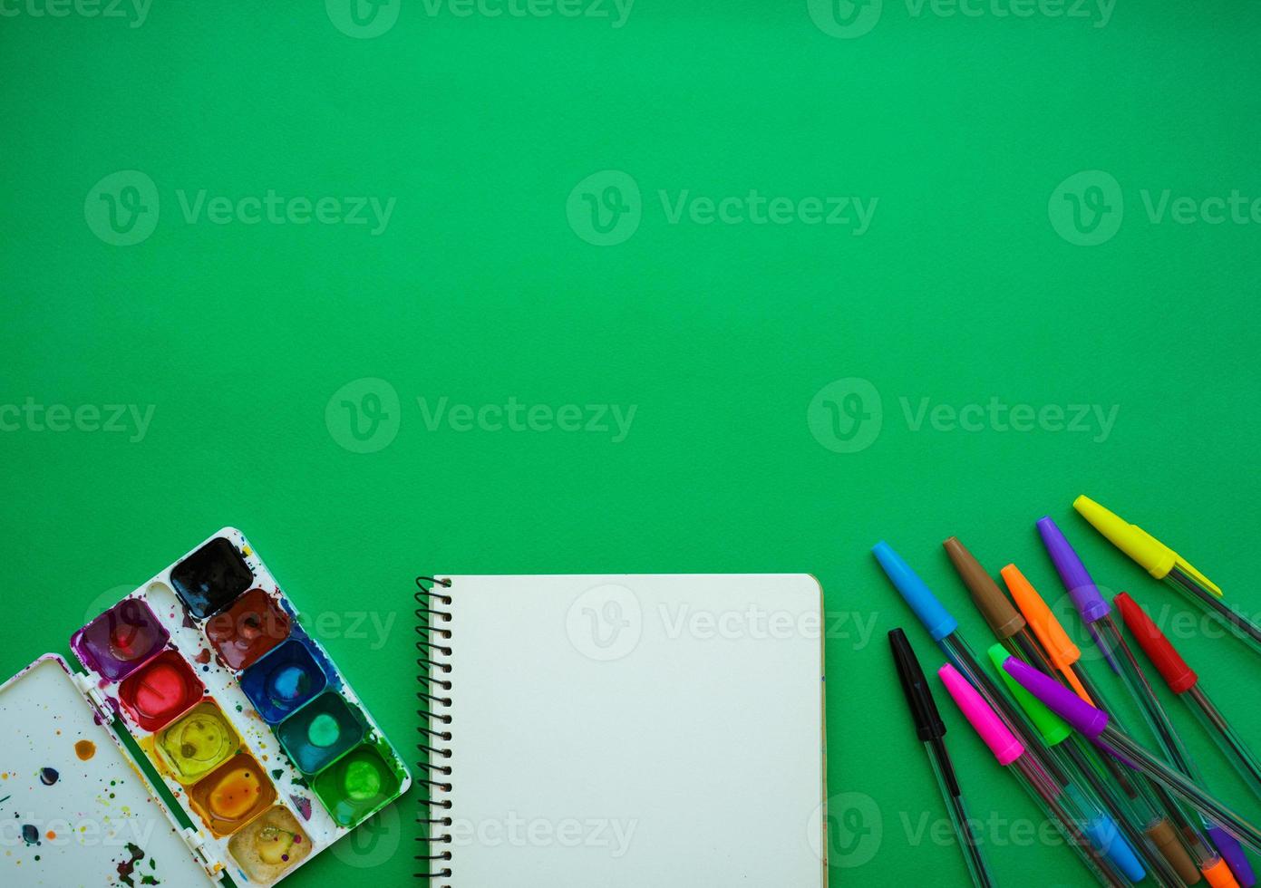 School supplies on blackboard background ready for your design photo