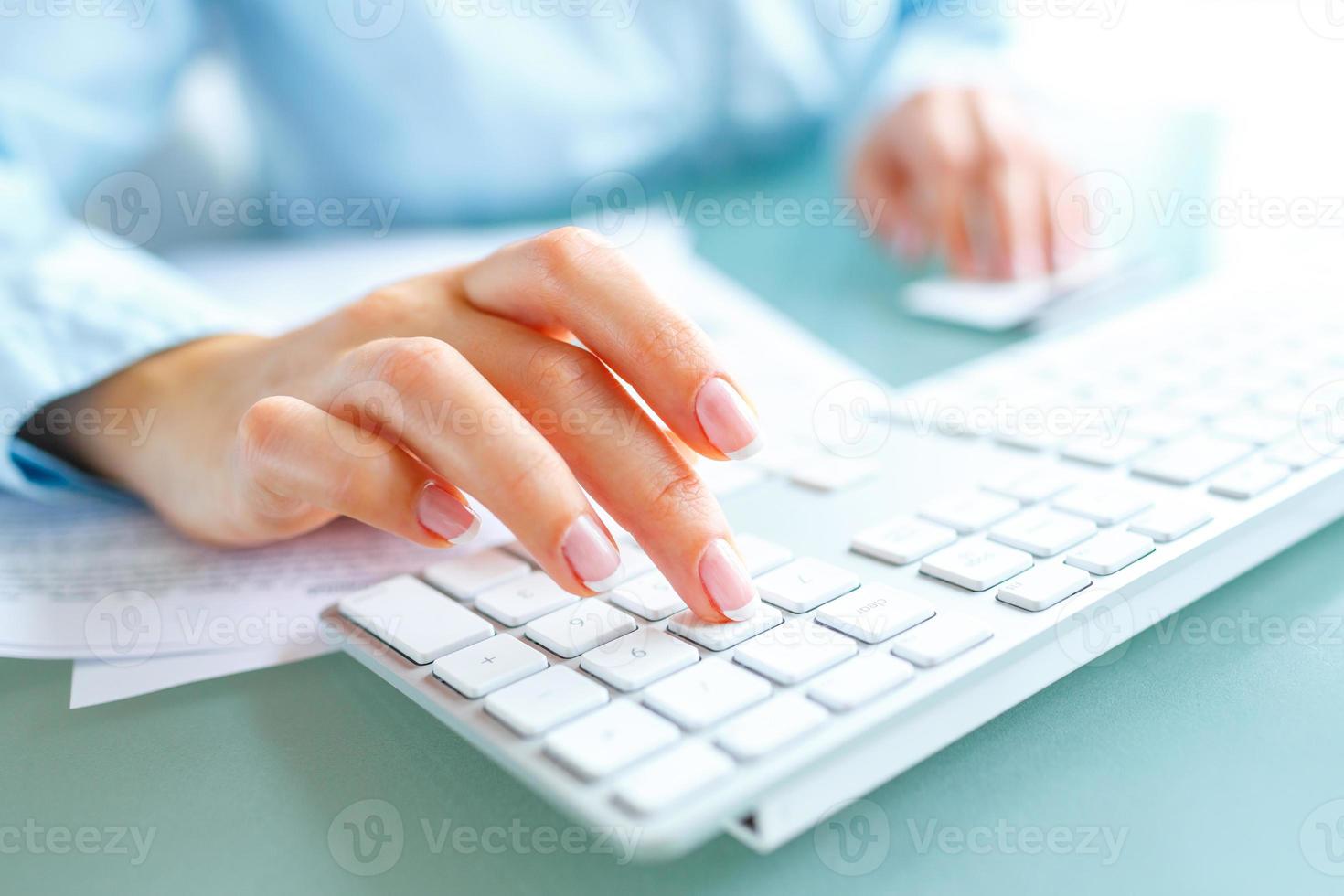 Hands using computer and credit card photo