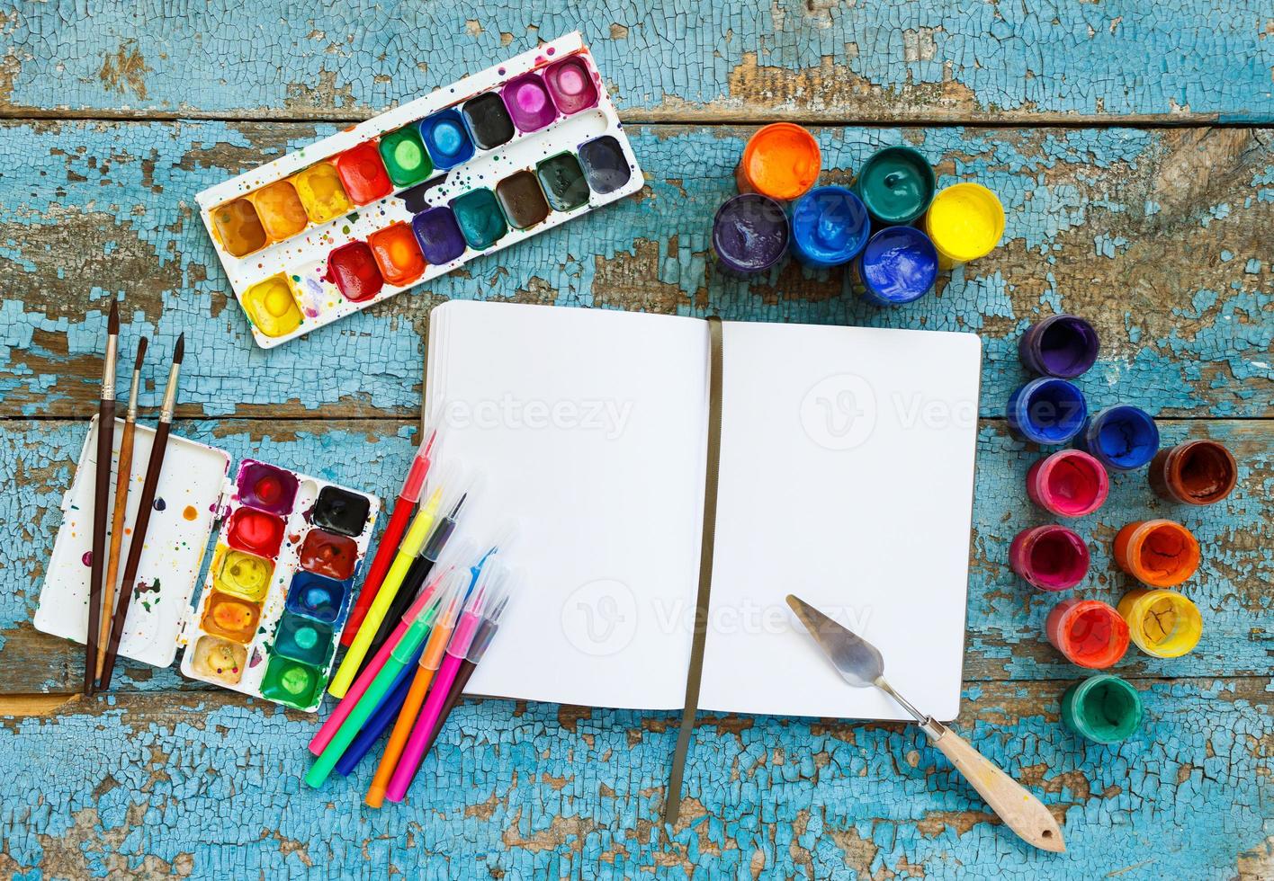 Art painting materials on wooden background photo