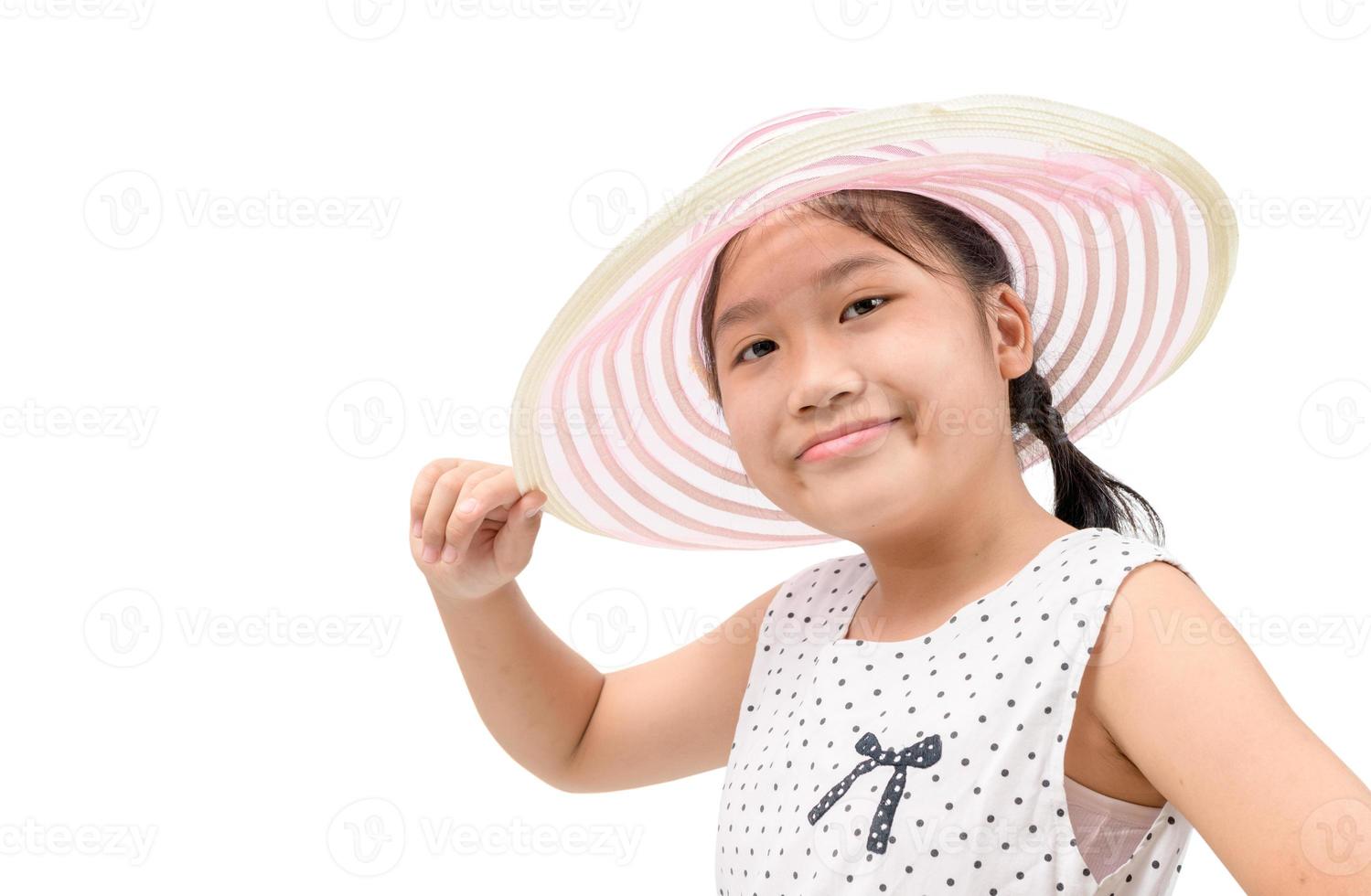 Adorable little girl wearing elegant hat isolated  on white background. photo