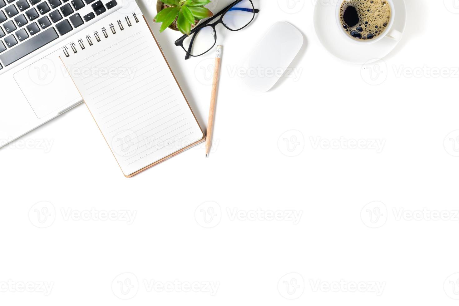 White office desk table, Blank notebook with laptop and hot coffee. photo
