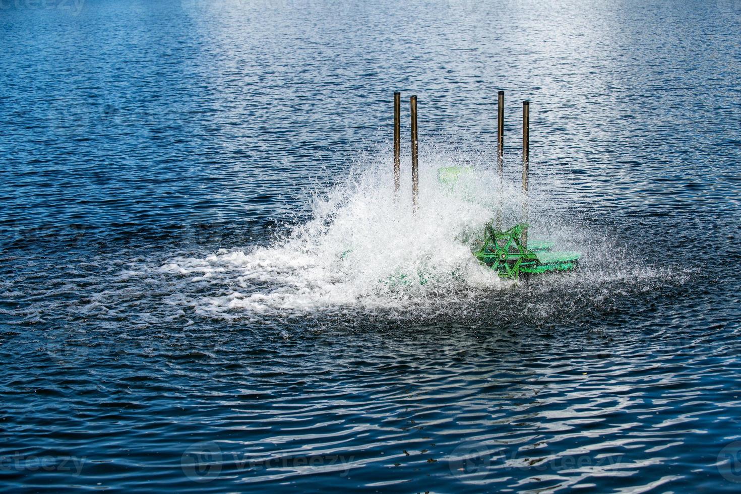 paddle wheels aerators in lake, waste water treatment by fill oxygen into water. photo