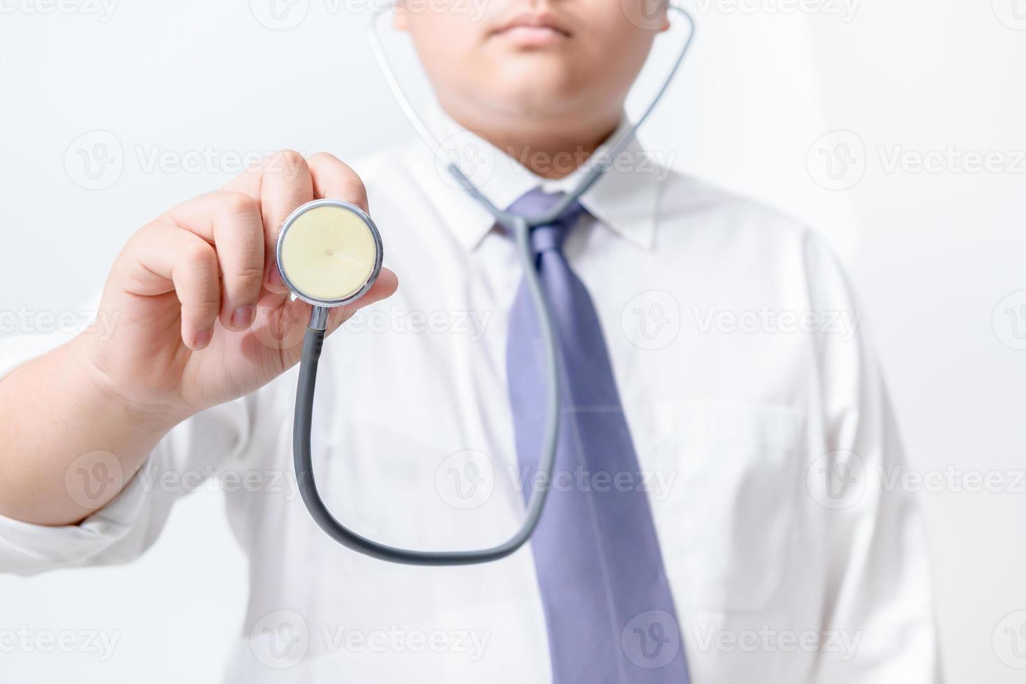 Young doctor holding stethoscope on white background. Concept Cosmetic Surgery photo