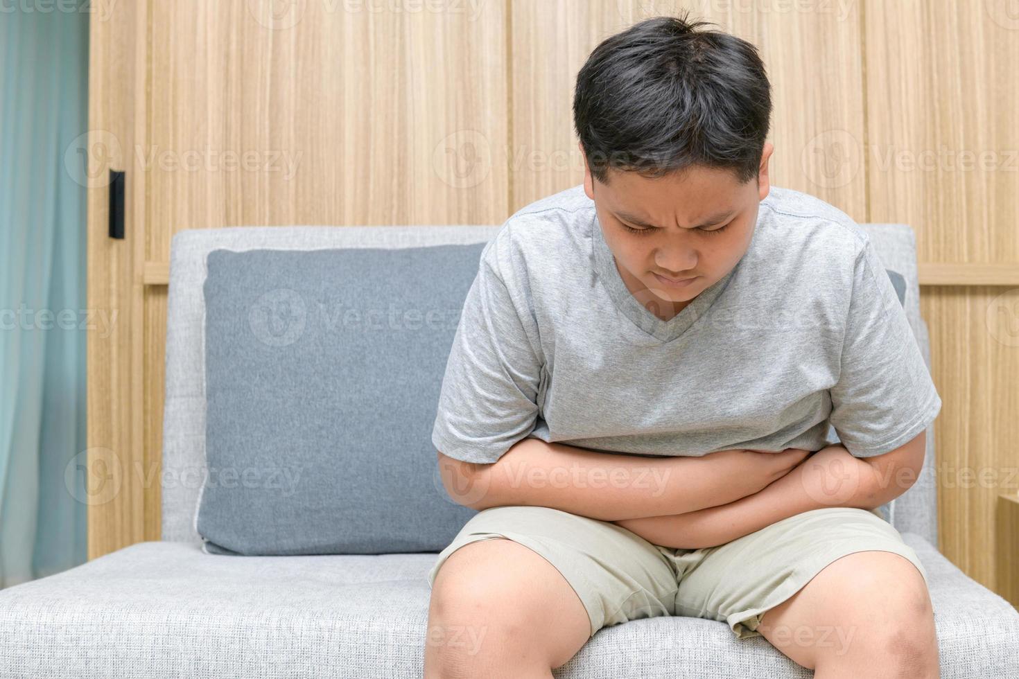 Fat boy feeling stomachache and sitting on the sofa, Diarrhea ...