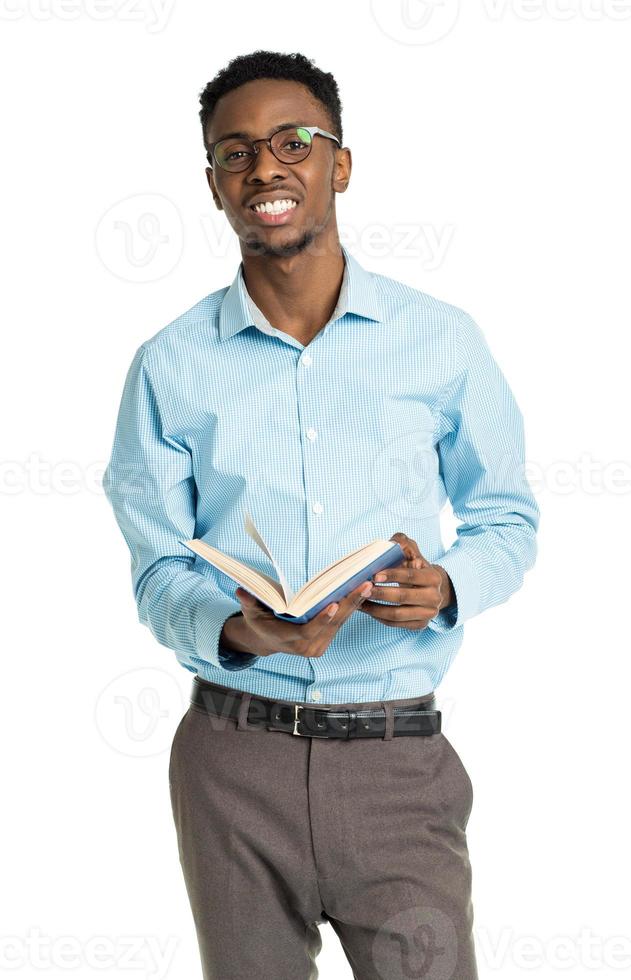 Happy african american college student with books in his hands photo