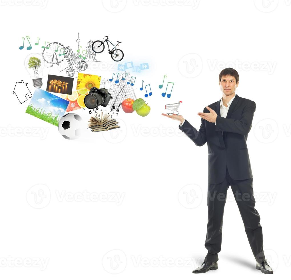 Shopping cart on palm of businessman and goods photo