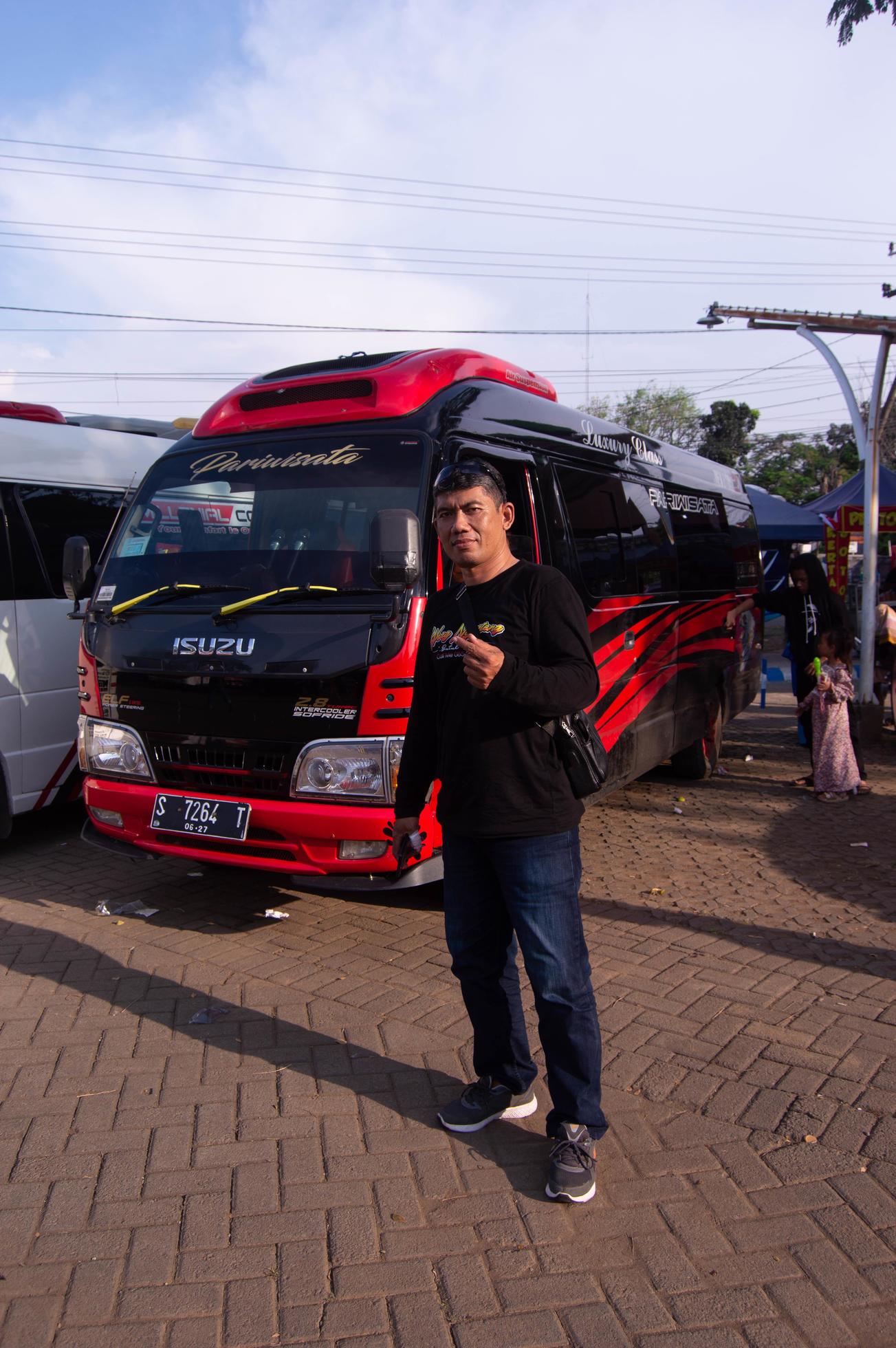 Pasuruan Indonesia June 2022 a person in front of a car in a Pasuruan Indonesia June 2022 a person in front of a car in a