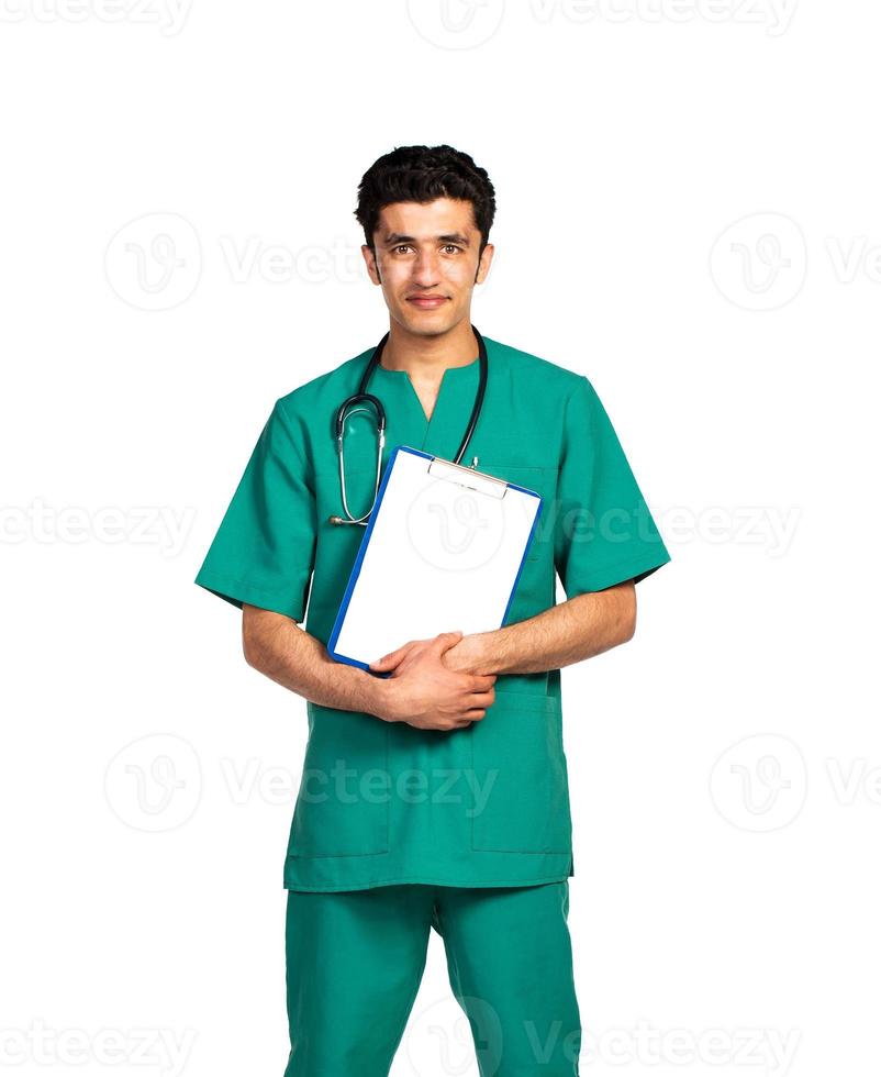 Portrait of doctor Arab nationality with health record on white photo