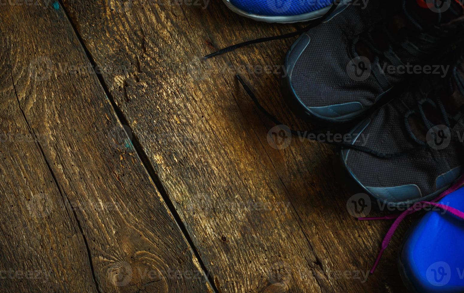 Sport, fitness, shoes, footwear  close up of sneakers on wooden background photo